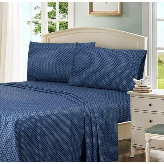 Navy blue Egyptian cotton bed sheets with geometric dot pattern, styled on a bed with matching pillows near a window