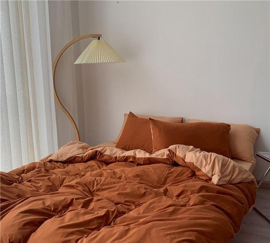 Luxury rust-colored Egyptian cotton bedding set with cozy duvet and pillows in a modern bedroom
