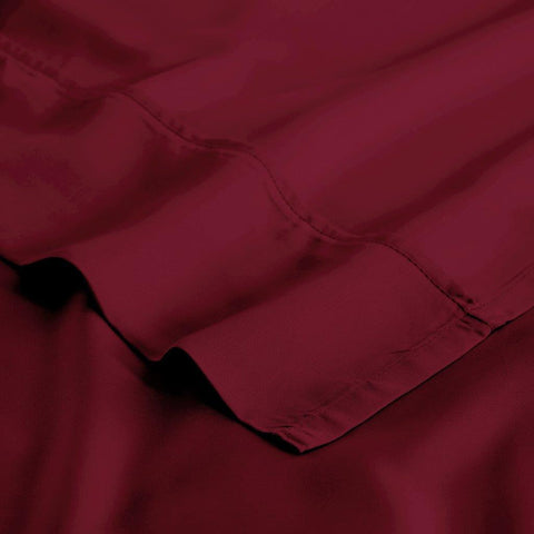 Luxury deep red Egyptian cotton bed sheet with fine stitching detail