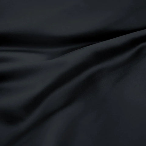 Luxury black Egyptian cotton bedding fabric with soft, smooth texture and elegant drape