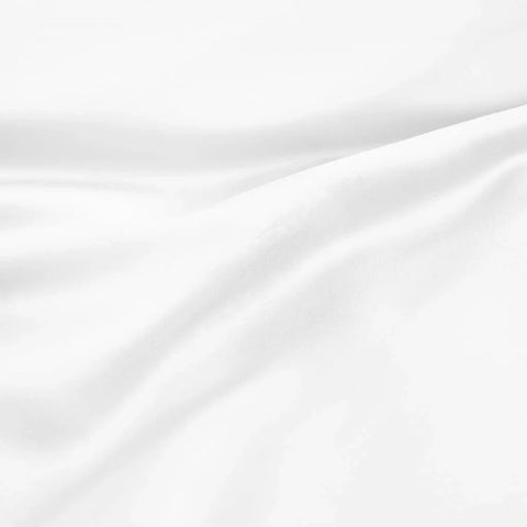 Soft white Egyptian cotton bed sheet with elegant folds and smooth texture