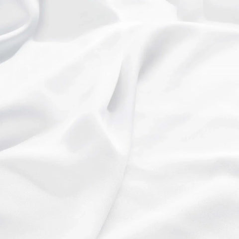 Luxury white Egyptian cotton bed sheet with soft, smooth texture and elegant drape